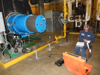 PBS Technician performing a combustion analysis on a burner